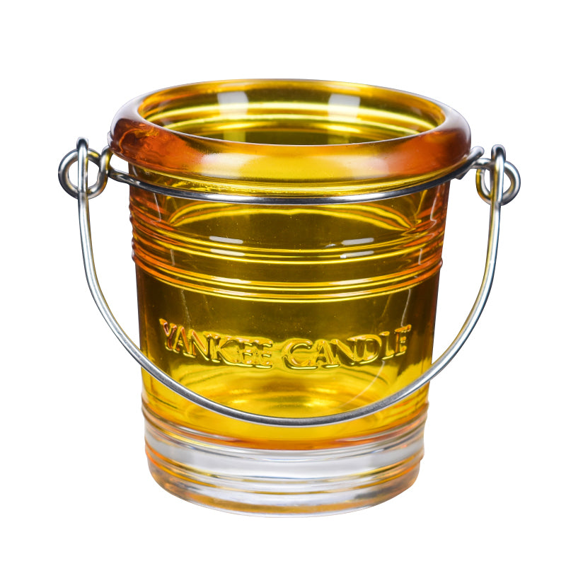 Yankee Candle geltona stiklinė žvakidė su rankenėle