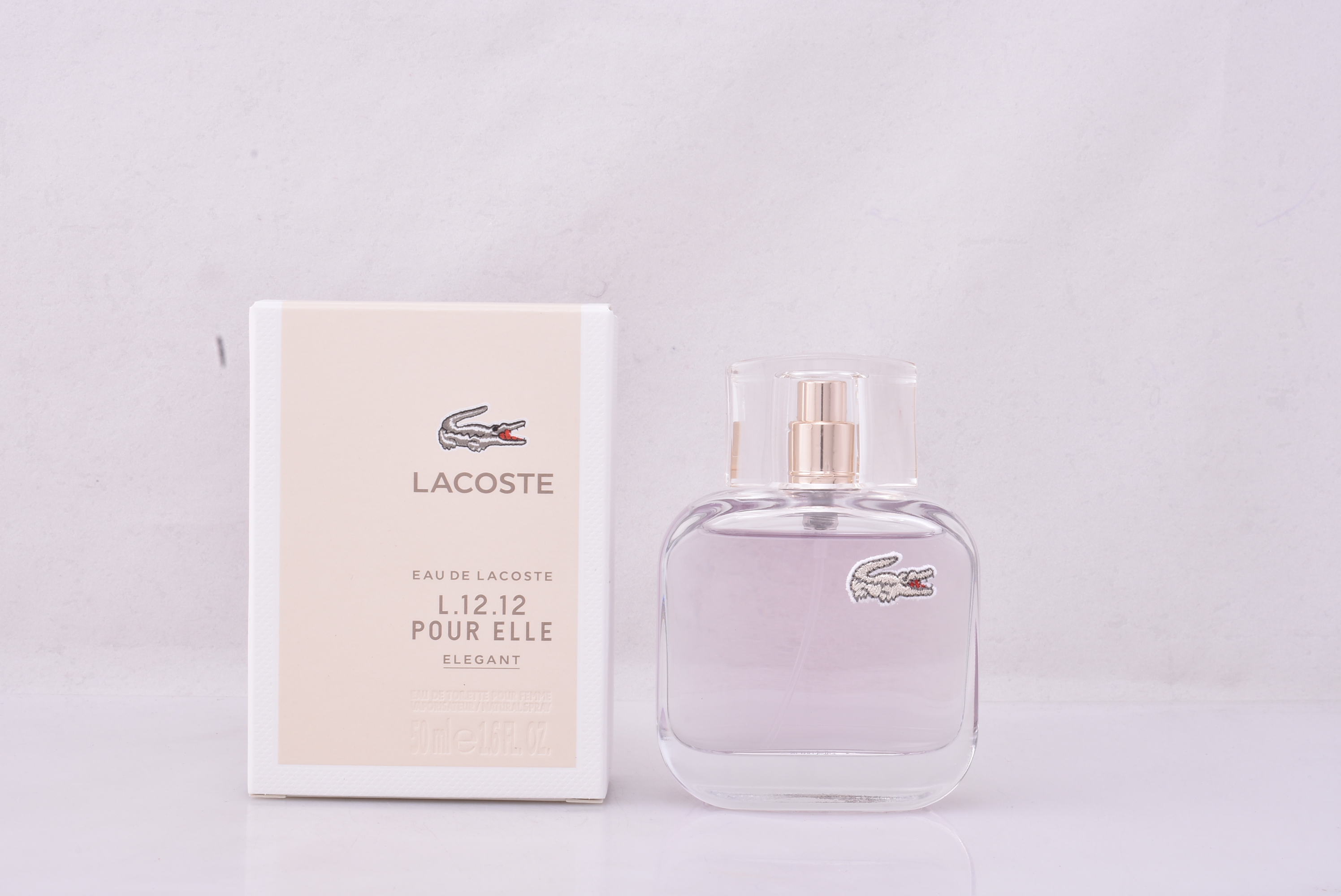 Лакост белый женский духи. Lacoste l.12.12 pour elle Elegant 50ml EDT. Лакост l1212 pour elle. Lacoste 1212 Elegant. Лакост л1212 женские.